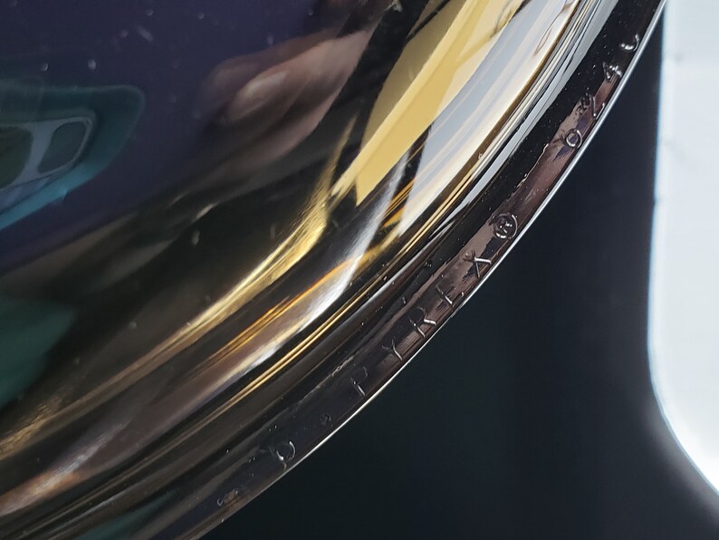 May include: Close-up of the bottom of a clear glass pot with the text "PYREX" printed on the side.