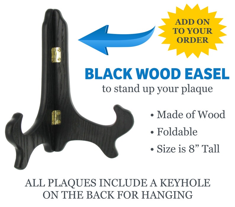 May include: Black wooden easel for displaying plaques. It is foldable and measures 8 inches tall. The easel is made of wood and has a keyhole on the back for hanging.