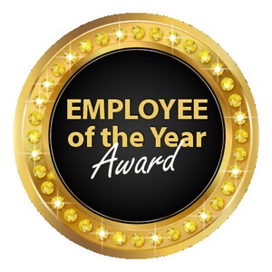 May include: A gold circular award with a black center and the text "EMPLOYEE of the Year Award" in white. The award is surrounded by a ring of gold stars.