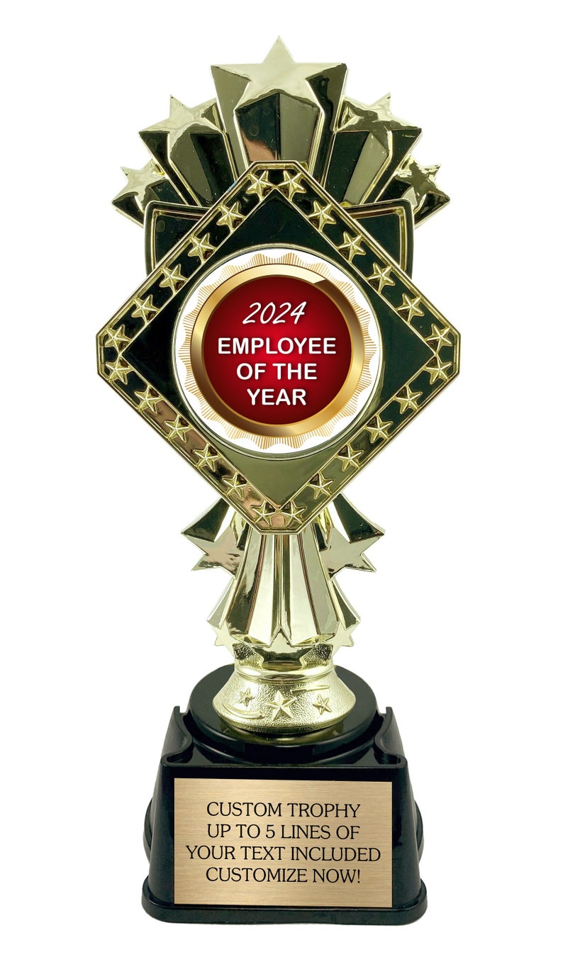 May include: Gold trophy with a black diamond-shaped base and a red and gold medallion that says "2024 Employee of the Year". The base has a gold plaque that says "Custom Trophy Up to 5 Lines of Your Text Included Customize Now!"