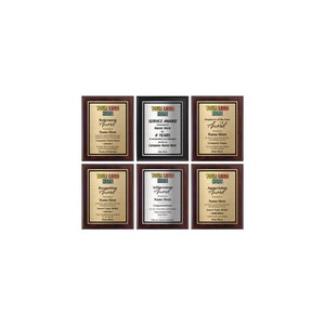 May include: Six different award plaques with mahogany frames. Each plaque has a gold, silver, or black background with a different award title, such as "Retirement Award", "Service Award", and "Employee of the Year Award".