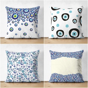 May include: Four decorative pillow covers with a white background and a blue and white evil eye pattern. The patterns include a scattered evil eye design, a larger evil eye design with black outlines, a scattered evil eye design with a white background, and a wave-like border of evil eyes.