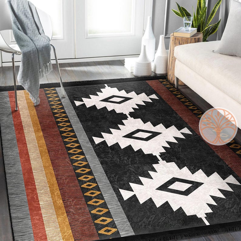 Rug Design Carpet: Black and white geometric rug with a southwestern design. The rug has a black background with white diamond shapes and a red, orange, and yellow border.