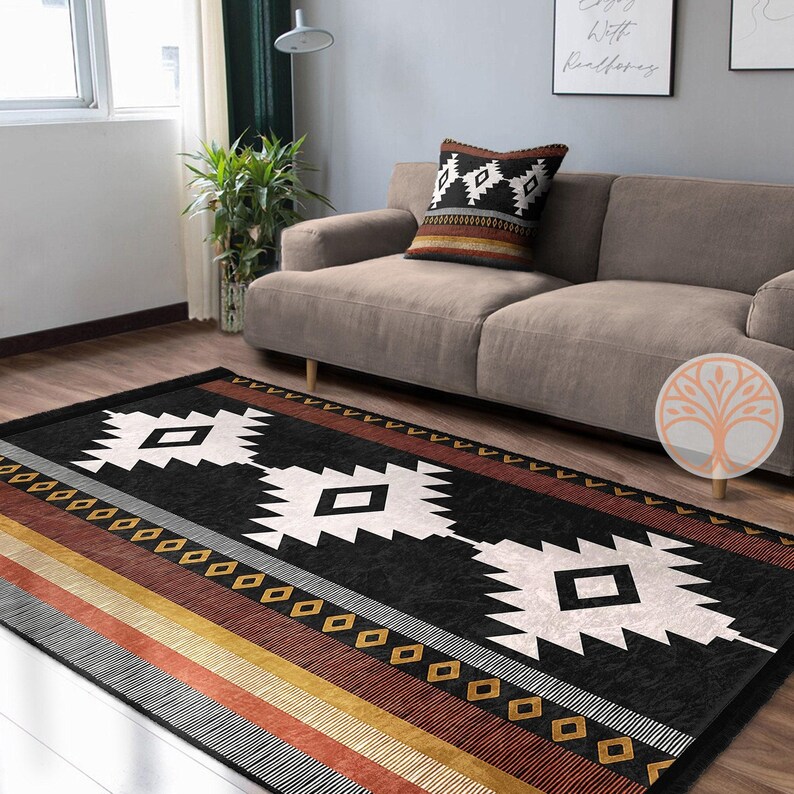 Rug Design Carpet: Black and white geometric rug with red, orange, and yellow stripes. The rug has a southwestern design with diamond shapes and a black background.