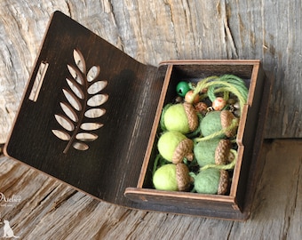 Green felted acorns in a box, Christmas ornaments