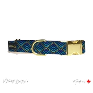 May include: A blue and gold patterned dog collar with a gold buckle and D-ring. The collar has the text "V.I.Pets" on it. Made in Canada.