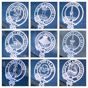May include: Nine white vinyl stickers with different designs and text. Each sticker features a crest with a central image and text around the outside. The crests include a lion, a hand holding a branch, a dagger, a raven, a seashell, a hand holding a dagger, a hand holding a dagger, a bearded man, and a lion.