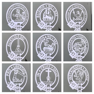 May include: Nine white circular designs with black text and images. The designs are on a grey background. The text includes "Touch Not The Cat But A Glove", "Auxilio Dei", "Pro Libertate", "Buaigh No Bas", "Buaigh No Bas", "Audentes Fortuna Juvat", "In Cruce Salus", "Mean Weill Speak Weill And Doe Weill", "Instauraor Ruinae".