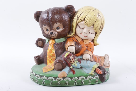 Cute vintage ceramic girl with teddy bear