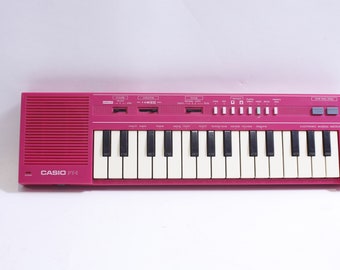 Casio PT-1 Vintage Child's Keyboard, Writing on Back, Small