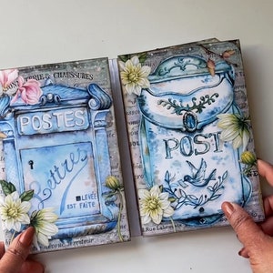 May include: Two vintage-style blue mailboxes with floral accents. The mailbox on the left says "POSTES" and "Lettres" with the text "LEV&Eacute;E EST FAITE". The mailbox on the right says "POST" with a small bird illustration. Both mailboxes have a white background with a floral design.