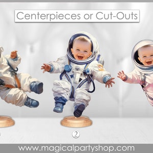 May include: Three white astronaut centerpieces with a baby's face in the helmet. The centerpieces are on a wooden base with the numbers 1, 2, and 3 printed on them. The text "Centerpieces or Cut-Outs" is at the top of the image. The text "www.magicalpartyshop.com" is at the bottom of the image.