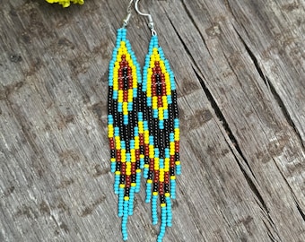 Hand woven sky blue, yellow, terracotta and black fringe earrings