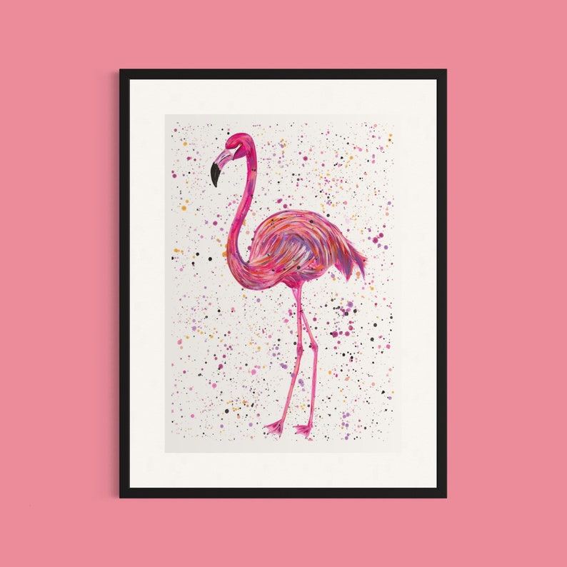 May include: A pink flamingo with a long neck and long legs stands on a white background with colorful paint splatters.