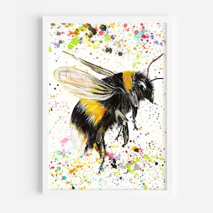 May include: Watercolor painting of a bumblebee in flight, with black and yellow stripes, set against a white background. The artwork features colorful paint splatters in various hues, including green, blue, and yellow, adding a vibrant touch to the piece.