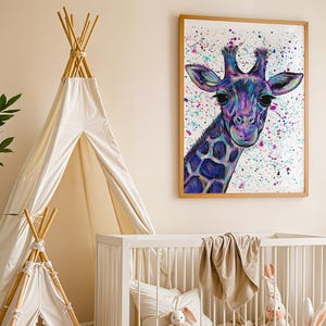 May include: A framed wall art print featuring a colorful giraffe portrait with vibrant purple, blue, and pink paint splatters on a white background. The giraffe has large dark eyes and a detailed neck pattern, displayed in a light wood frame.