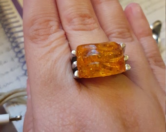 Ring with hard stone in synthetic amber