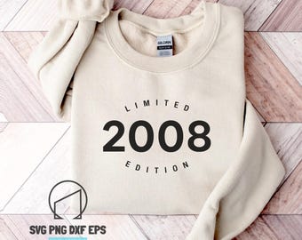 May include: A cream-colored crewneck sweatshirt featuring the black text LIMITED EDITION arched above and below the large bold number 2008. The garment has long sleeves and a ribbed collar, with a Gildan brand label visible at the inner neckline.