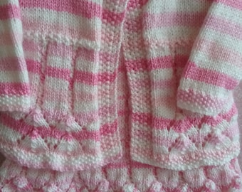 Babys pink candy stripe dress, with matching cardigan, booties and hat.