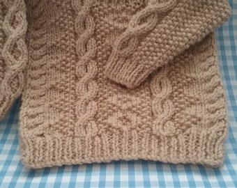 A little babys cosy unisex jumper.