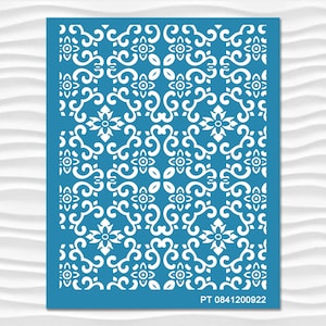 May include: A blue stencil with a white repeating pattern of stylized flowers and swirls. The stencil has the text "PT 0841200922" at the bottom.