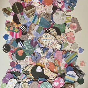 May include: A large collection of colourful paper shapes, including circles, hearts, and squares, with various patterns and designs. The shapes are cut from patterned paper and have a stitched edge.