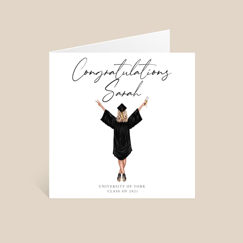 May include: Congratulations Sarah, University of York Class of 2021. A graduation card with a black and white illustration of a woman in a graduation cap and gown holding a diploma and a glass of champagne.