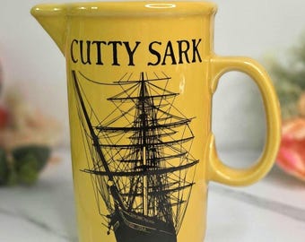 Vintage Yellow Ceramic Cutty Sark Scotch Whisky Bar Pitcher or Pub Jug - The Buckingham Corporation, Importers New York, N.Y. - 6.75"