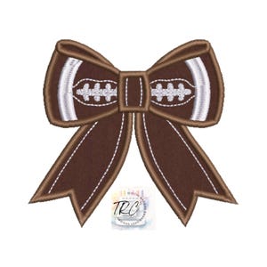 May include: A brown football-shaped bow with white stitching and accents. The bow has a football design in the center and is suitable for sports-themed crafts and decorations. The bow is a digital machine embroidery design.