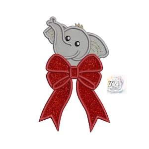 May include: Embroidered design of a gray elephant with a red bow. The elephant has a small crown on its head and is looking up. The bow is tied with a red ribbon.