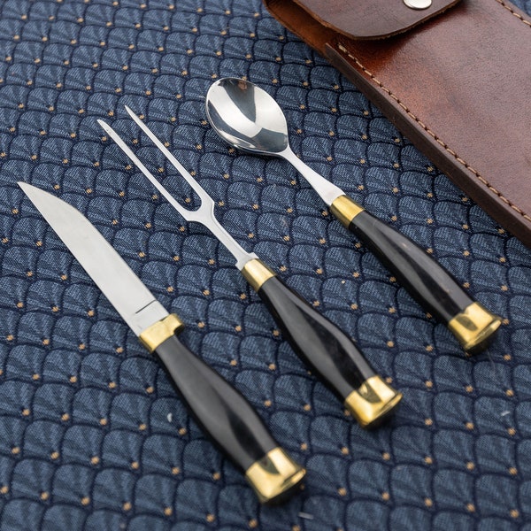 Medieval horn cutlery set with brown leather case that attaches to belt.