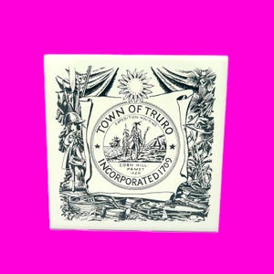 May include: A square, off-white ceramic tile featuring a black and white illustration of the Town of Truro seal. The seal includes text, a sun, a ship, and figures. The tile is surrounded by a bright pink background.