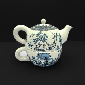 May include: Blue and white tea set with a teapot and a cup. The teapot and cup are decorated with a traditional Chinese pattern.