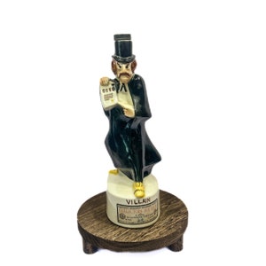 Vintage 1969 Villain Decanter By Royal Enfield (Empty) Evil Villain Holding Deed In Black Top Hat 12”
