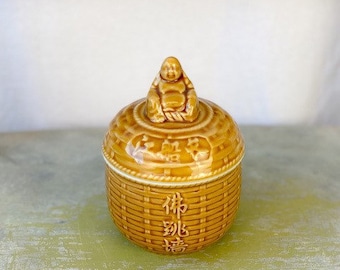 Vintage Tan Ceramic Meditation Buddha Storage jar. Sitting Buddha on basket weave canister