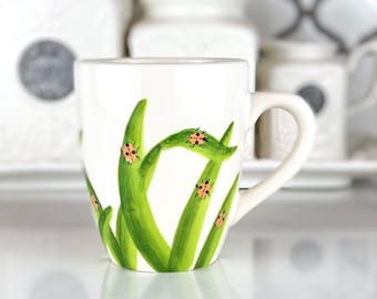 Lady Bug In Tall Grass Coffee Mug