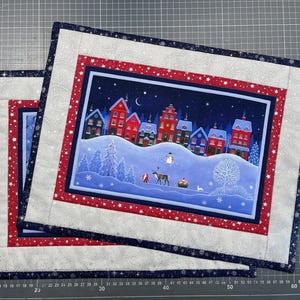 two placemats (Christmas motifs) approx. 33 x 44 cm