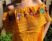 Beautiful blouse embroidered by artisans from the state of Puebla Mexico.