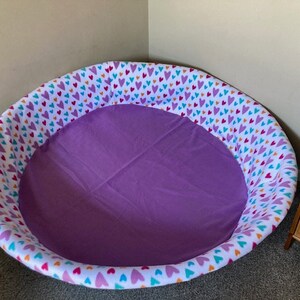 Large Whelping pool cover to keep newborn puppies safe and clean.