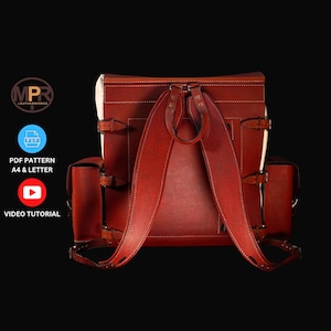 May include: A red leather backpack with two side pockets and adjustable straps. The backpack has a white leather trim and stitching.