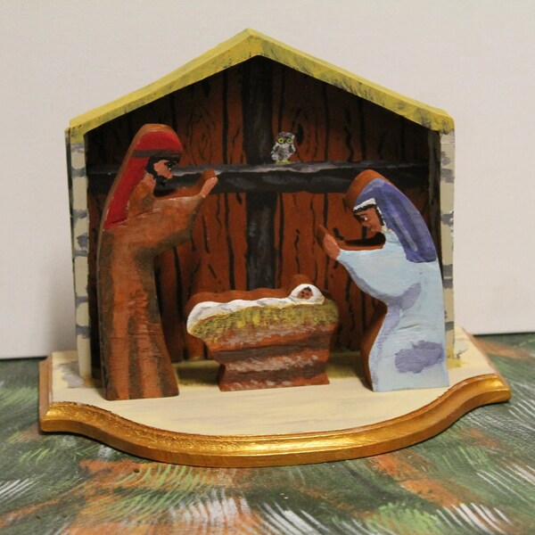 Wood Nativity Family carvings and manager scene.  Acrylic