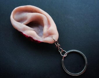 Severed silicone ear prop keyring