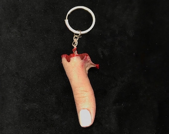Severed silicone thumb finger prop keyring