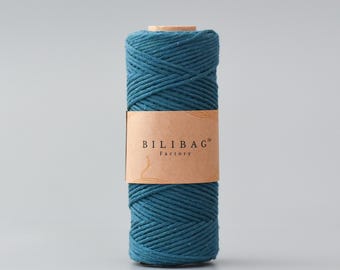 May include: A teal blue cotton rope, wound into a spool, with a brown label that reads "Bilibag™ Factory".