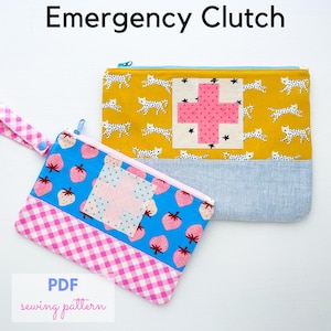 May include: Two colorful zippered pouches. One is yellow with cat patterns and a pink cross design. The other is blue with strawberry patterns and a pink cross design. The text "Emergency Clutch" and "PDF sewing pattern" are visible.