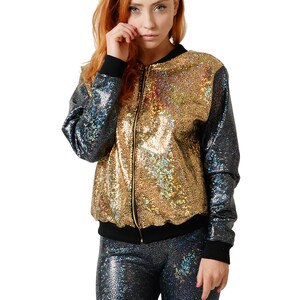 May include: A gold and black sequined bomber jacket with a zipper closure. The jacket has a iridescent sheen.