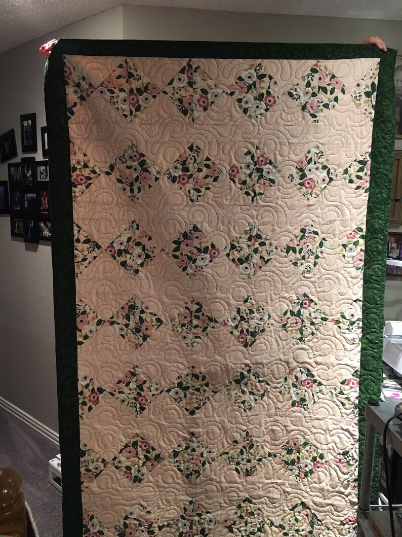 Pink polka dot and floral quilt
