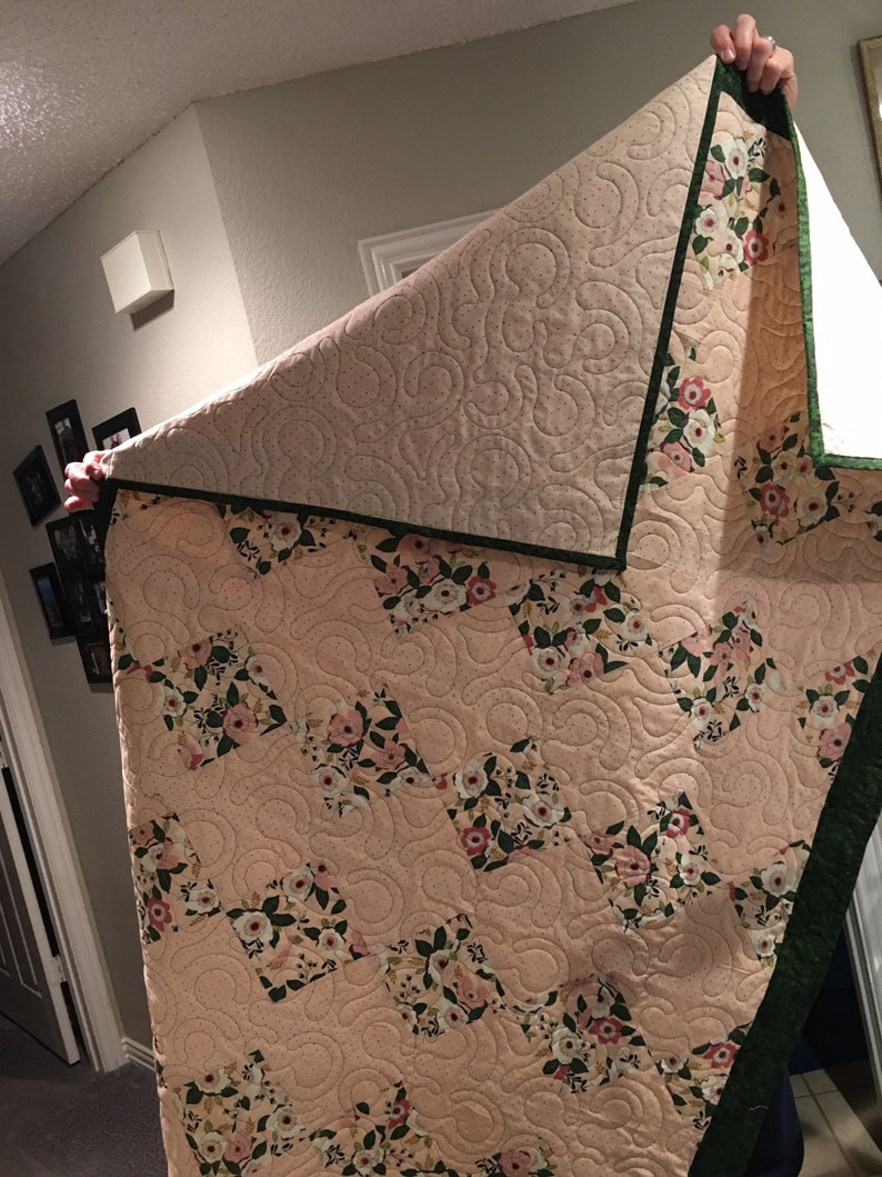 Pink polka dot and floral quilt