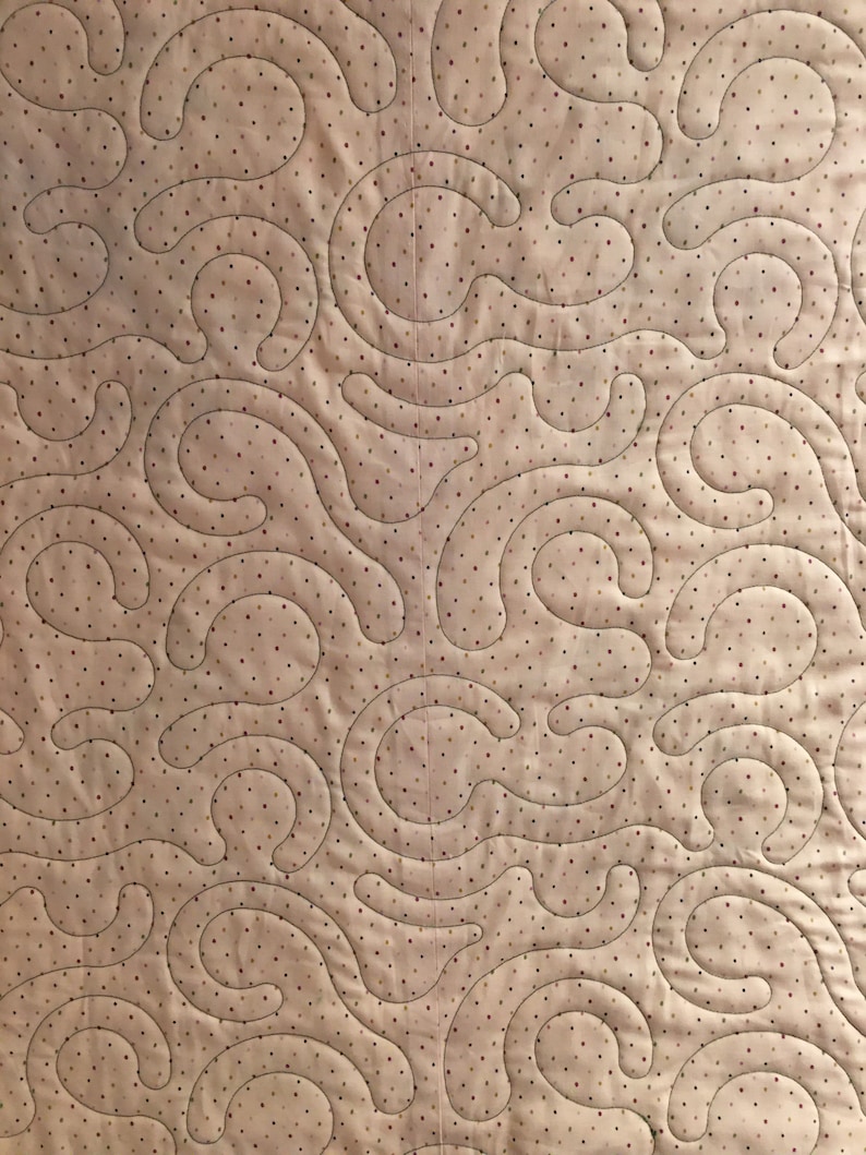 Pink polka dot and floral quilt