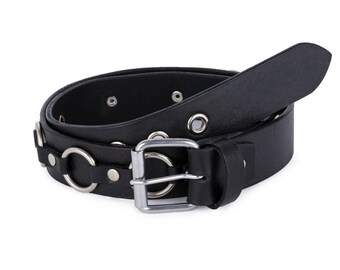 May include: A black leather belt with silver metal rings and a buckle. The belt has multiple rows of eyelets.